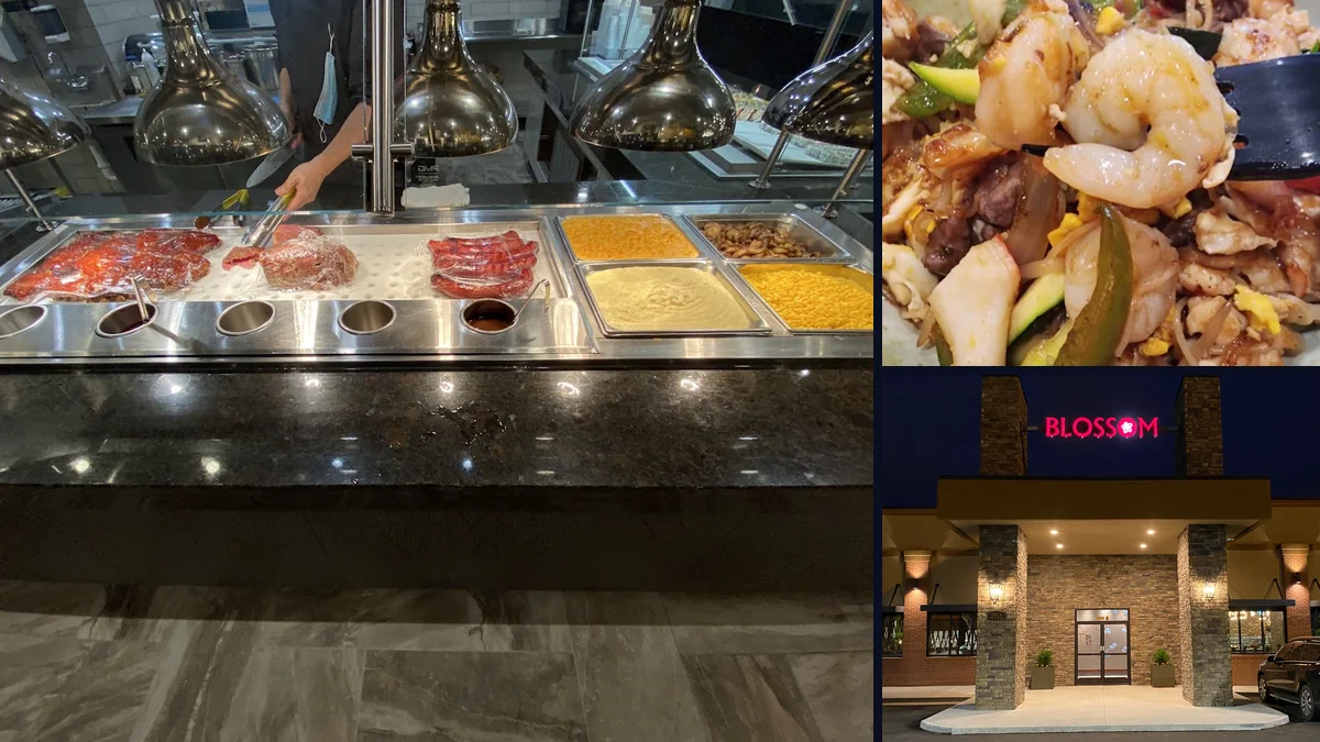 Colorful food trays arranged under bright buffet lights.